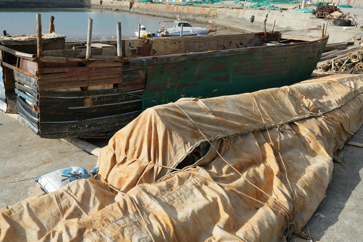 Boat hull laid up ashore in a boatyard